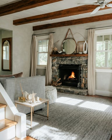 Cozy cabin living room with exposed beams and stone fireplace